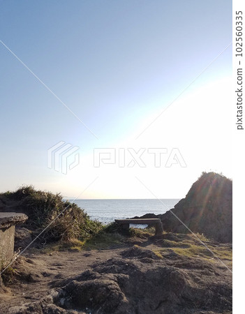 Serene coast and rainbow Serene coast and rainbow 102560335