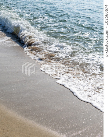 Waves on the sandy beach. (vertical composition) Waves on the sandy beach. (vertical composition) 102560674