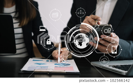 Person using  laptop computer and tablet with SDK icon on virtual screen. SDK Software development kit programming language technology concept in office. 102566142