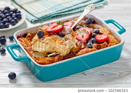 Sweet Croissant Casserole with Berries in dish Sweet Croissant Casserole with Berries in dish 102566163