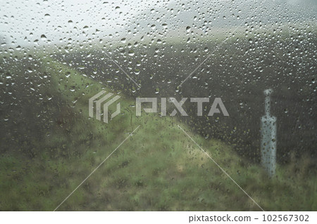 Scenery from the train window on a rainy day Scenery from the train window on a rainy day 102567302
