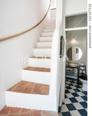 Vintage typical steps in an old house and a toilet in the background. Vintage typical steps in an old house and a toilet in the background. 102567326