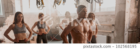 Group of people exercising with ball at gym 102568195