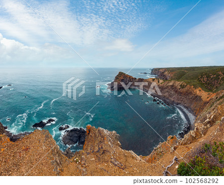 Summer Atlantic ocean rocky coastline (Algarve, Portugal). 102568292
