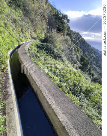 Wonderful hiking trail along levada on Madeira Island, Wonderful hiking trail along levada on Madeira Island, 102570286