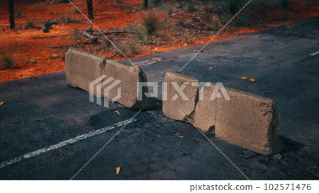 old rusted concrete road barrier blocks 102571476