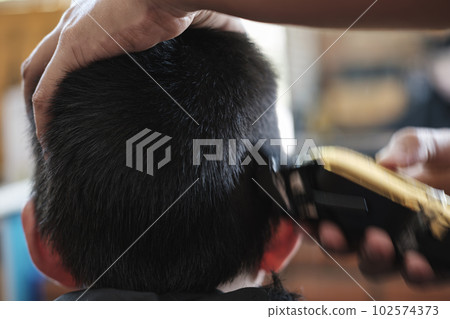 Little Asian Thai Boy cutting hair. 102574373