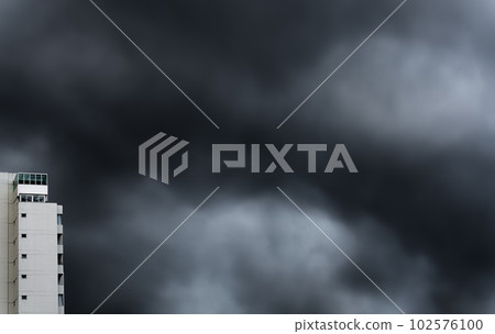 Impassive Skyscrapers under Ominous, Dark, Stormy Clouds 102576100