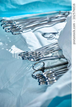 Close-up of surgical instruments on the table in the operating room, modern medicine, sterilization of medical instruments 102576816