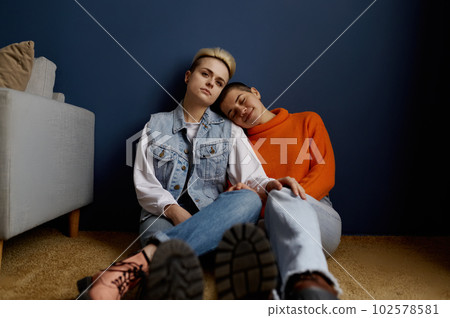 Romantic lesbian couple enjoying calm and happiness moments together 102578581