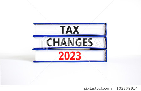 Tax changes 2023 symbol. Concept words Tax changes 2023 on books on a beautiful white table white background. Business Tax changes 2023 concept. Copy space. 102578914