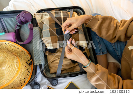 Young dark-haired woman ready for the departure Young dark-haired woman ready for the departure 102580315