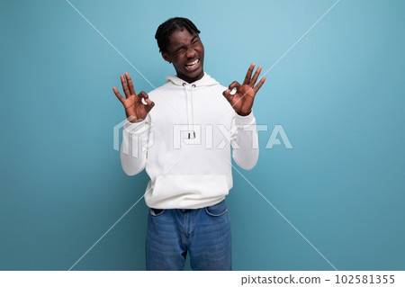 skillful african young man with dreadlocks shows that everything is ok skillful african young man with dreadlocks shows that everything is ok 102581355