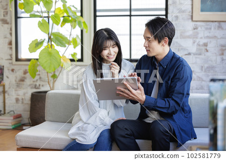 Girls watching tablets Girls watching tablets 102581779