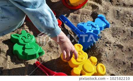 a child sculpts animals out of sand, sand molds, sandbox games, entertainment for children, childrens toys, beach holidays a child sculpts animals out of sand, sand molds, sandbox games, entertainment for children, childrens toys, beach holidays 102582210