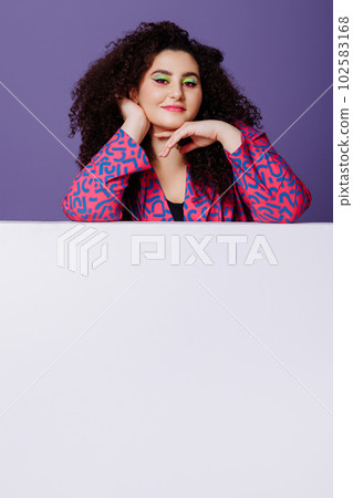 Plus size woman in bright suit 102583168