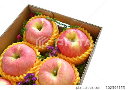 beautiful pink apple in the box on white background beautiful pink apple in the box on white background 102596155