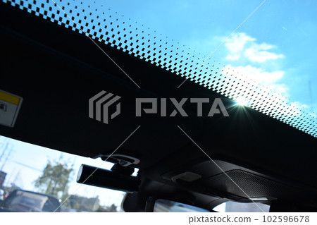 sunroof of car with blue sky, interior design 102596678