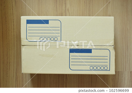 brown post box packaging put on wood floor brown post box packaging put on wood floor 102596699