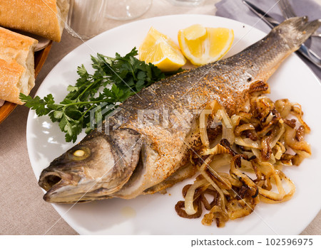 Delicious fish dish - baked sea bass 102596975
