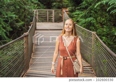 Woman tourist in Rope bridge in Yildiz Park. Besiktas, Istanbul, Turkey. Turkiye 102600330