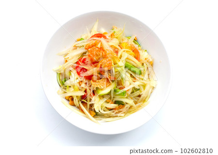 Dish of spicy papaya salad on white. Dish of spicy papaya salad on white. 102602810