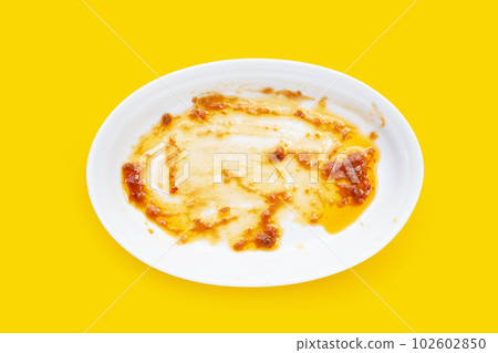 Dirty dish on yellow background. Top view 102602850