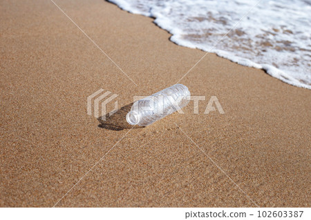 Plastic bottle on the beach Plastic bottle on the beach 102603387