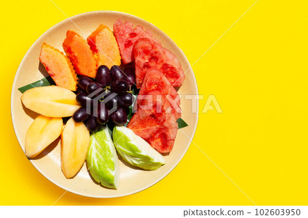 Fresh fruits in plate. Exotic fruits Fresh fruits in plate. Exotic fruits 102603950