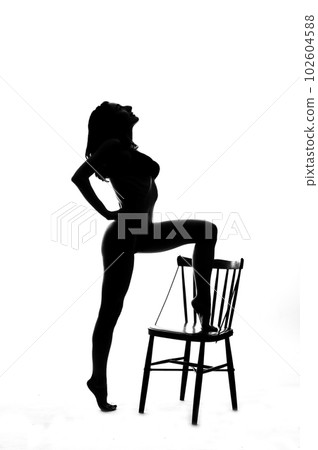 Silhouette of a sexy pole dancer isolated on white Silhouette of a sexy pole dancer isolated on white 102604588