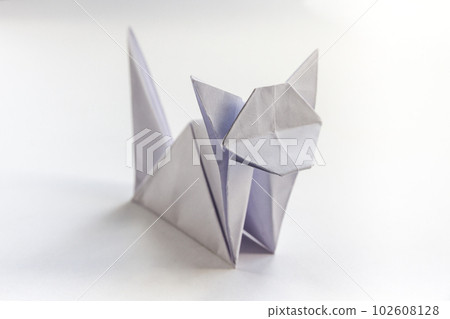 Paper cat origami isolated on a white background Paper cat origami isolated on a white background 102608128