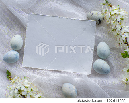 Light blue painted easter eggs on white background with copy space Light blue painted easter eggs on white background with copy space 102611631