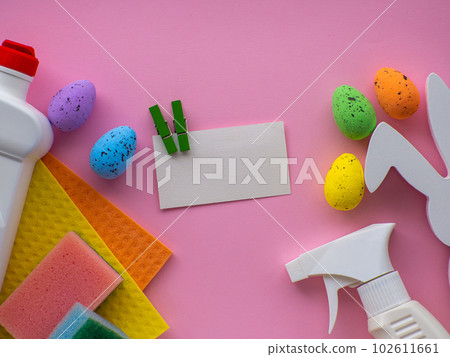 Detergent with Easter decoration on pink background with copy space Detergent with Easter decoration on pink background with copy space 102611661