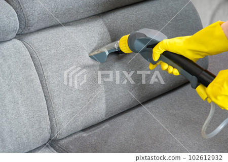 Sofa before and after wet - cleaning indoors. textile sofa vacuum cleaning 102612932