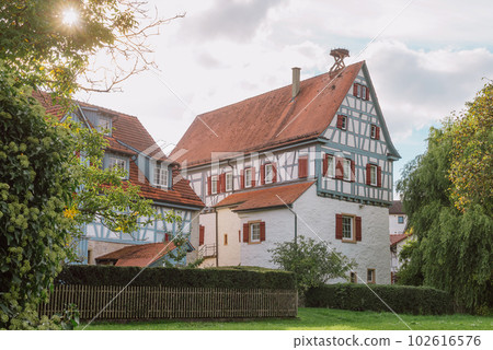 Traditional Rural House With Beautiful Exterior Facade Decor In Germany. German Old Construction House. Ancient European City. German National Architecture Traditional Rural House With Beautiful Exterior Facade Decor In Germany. German Old Construction House. Ancient European City. German National Architecture 102616576