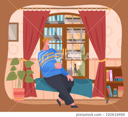 Young man sitting on windowsill at home looking out the window. Spending time at home after work 102618400