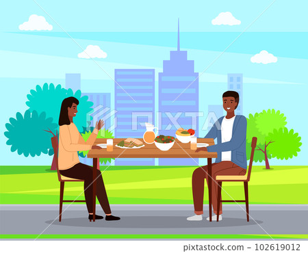 People on a date against the backdrop of city buildings. Couple eating natural fresh products People on a date against the backdrop of city buildings. Couple eating natural fresh products 102619012