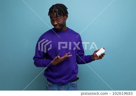 handsome african young man holding credit card mockup handsome african young man holding credit card mockup 102619683
