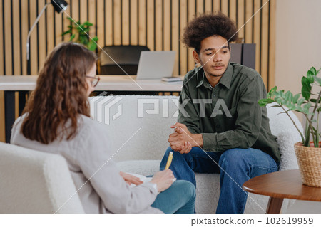 young man in consultation with psychologist is taking care of mental health. young man in consultation with psychologist is taking care of mental health. 102619959