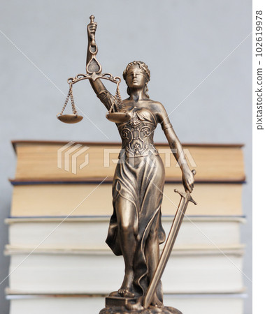 themis goddess of justice statuette, symbol of law with scales and sword in his hands themis goddess of justice statuette, symbol of law with scales and sword in his hands 102619978