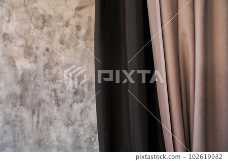 Part of the curtain fabric near the wall, a combination of two colors with space for copying. High quality photo 102619982