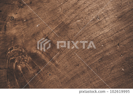 Old grunge background made of dark textured wood, surface made of old brown wood texture. A template for your design with space to copy. High quality photo 102619995