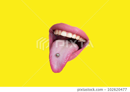 Sensual girl's mouth, tongue down, showing jewelry earrings with white teeth and a natural lipstick on the lips 102620477