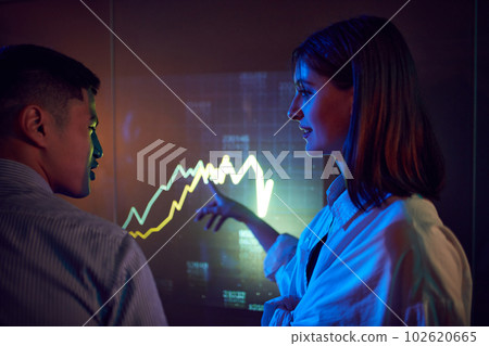 Employees at business meeting, conference making professional presentation, showing graphs on digital screen. Discussion 102620665