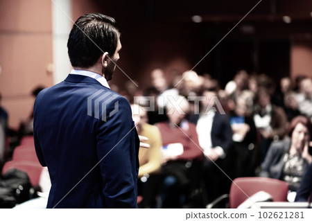 Speaker giving a talk on corporate Business Conference. Audience at the conference hall. Business and Entrepreneurship event. Speaker giving a talk on corporate Business Conference. Audience at the conference hall. Business and Entrepreneurship event. 102621281