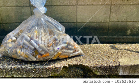 littered cigarette butts 102625610