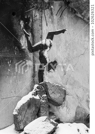 Ukraine, Borodyanka - Banksy graffiti on the wall, black and white photo 102626321