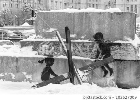 Banksy graffiti in the center of Kyiv, Ukraine, black and white photo Banksy graffiti in the center of Kyiv, Ukraine, black and white photo 102627009