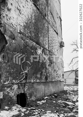 IRPIN, UKRAINE - NOVEMBER 29, 2022: Gymnast with ribbon - Banksy graffiti in Irpin, Ukraine, black and white photo IRPIN, UKRAINE - NOVEMBER 29, 2022: Gymnast with ribbon - Banksy graffiti in Irpin, Ukraine, black and white photo 102627022