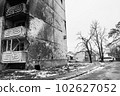 IRPIN, UKRAINE - NOVEMBER 29, 2022: Irpin, Ukraine - Banksy graffiti on the wall of a destroyed house, black and white photo 102627052